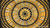 Rosette from stylized flowers and leaves (1918)